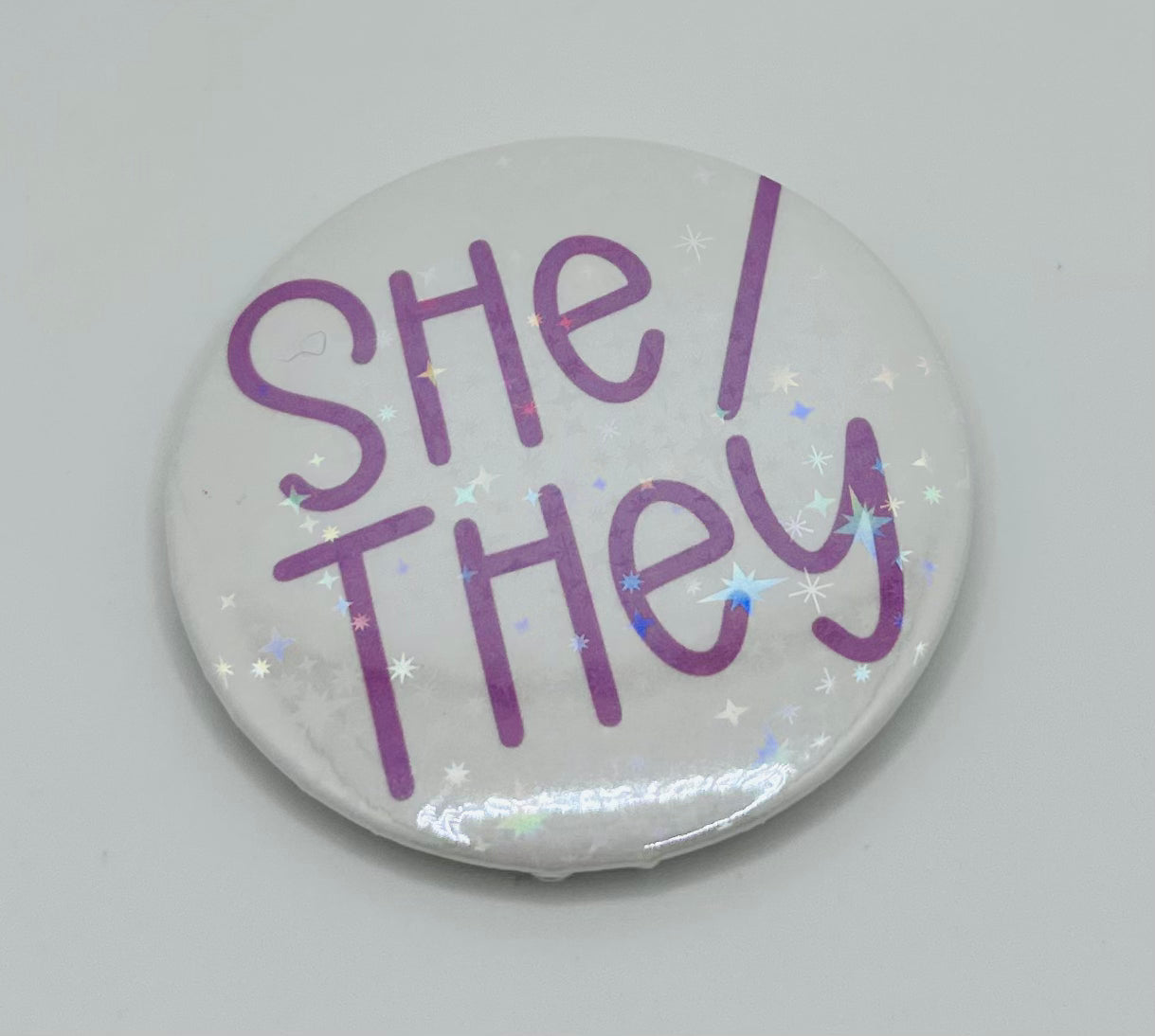 Holographic She/They Pronoun Buttons