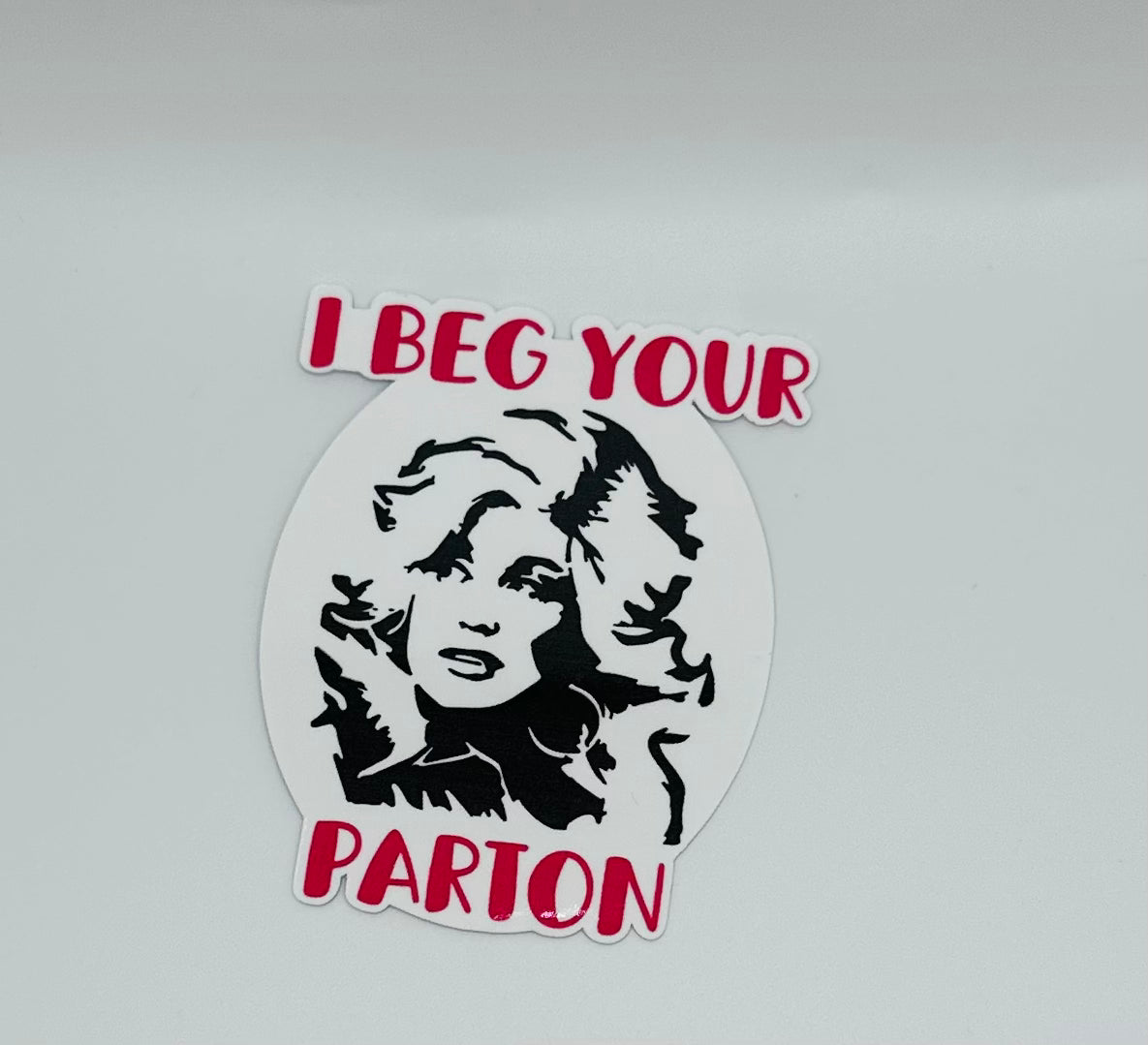 I Beg Your Parton Sticker