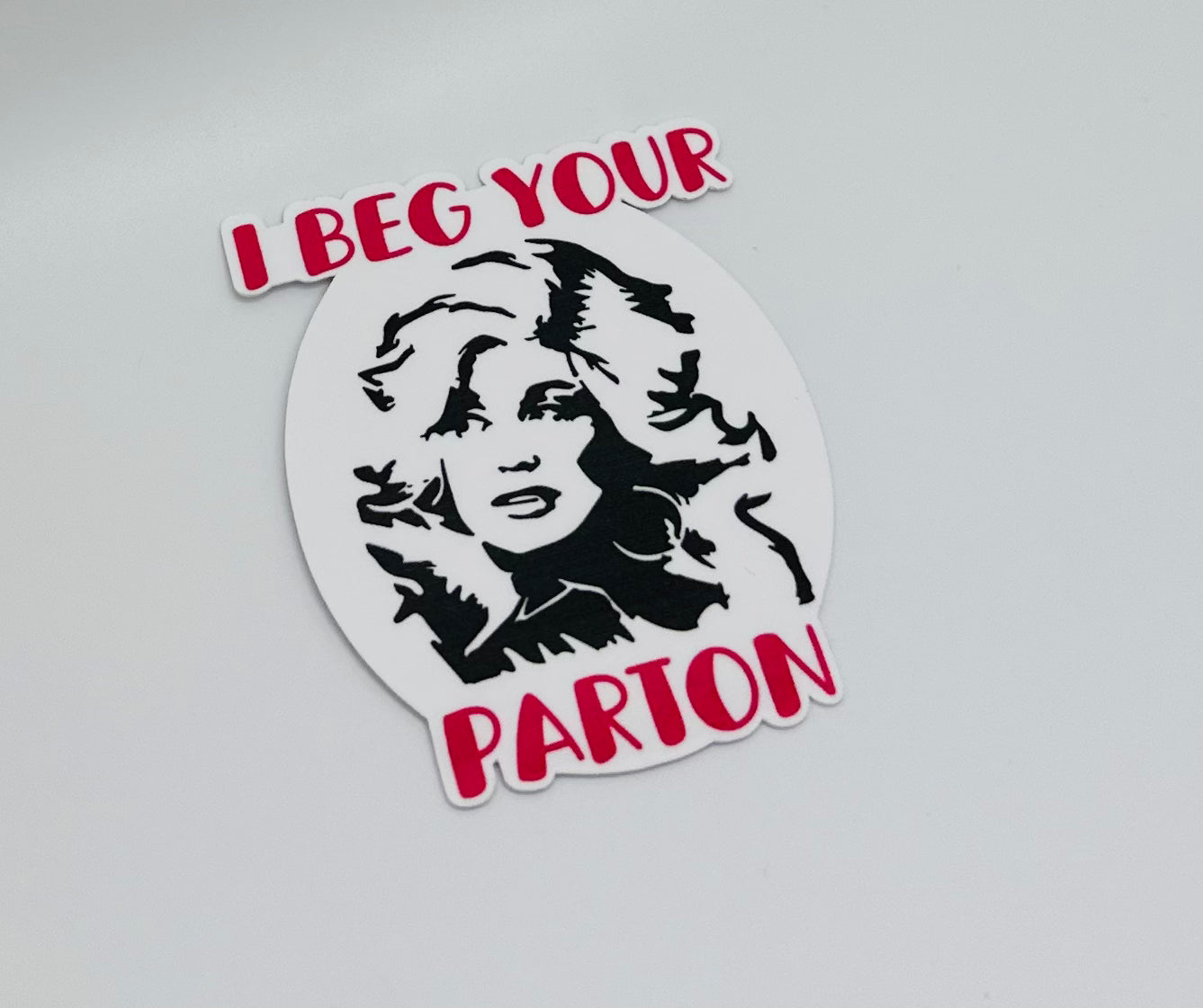 I Beg Your Parton Sticker